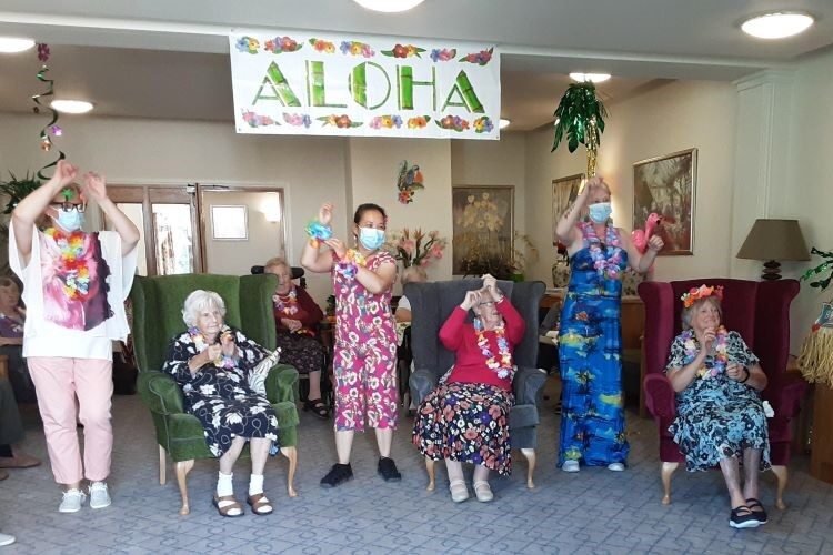 Hawaiian party at care home, residents celebrate