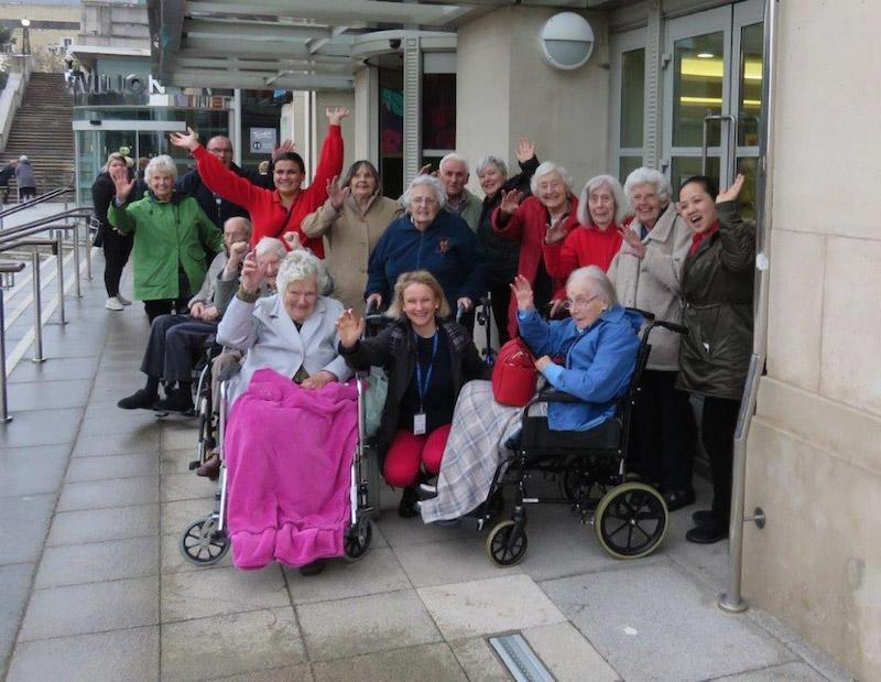 Music and Arts Partner Fiona Pritchard, sitting centre, with residents and team members from various Colten Care homes on a trip to Pavilion Dance South West in Bournemouth.