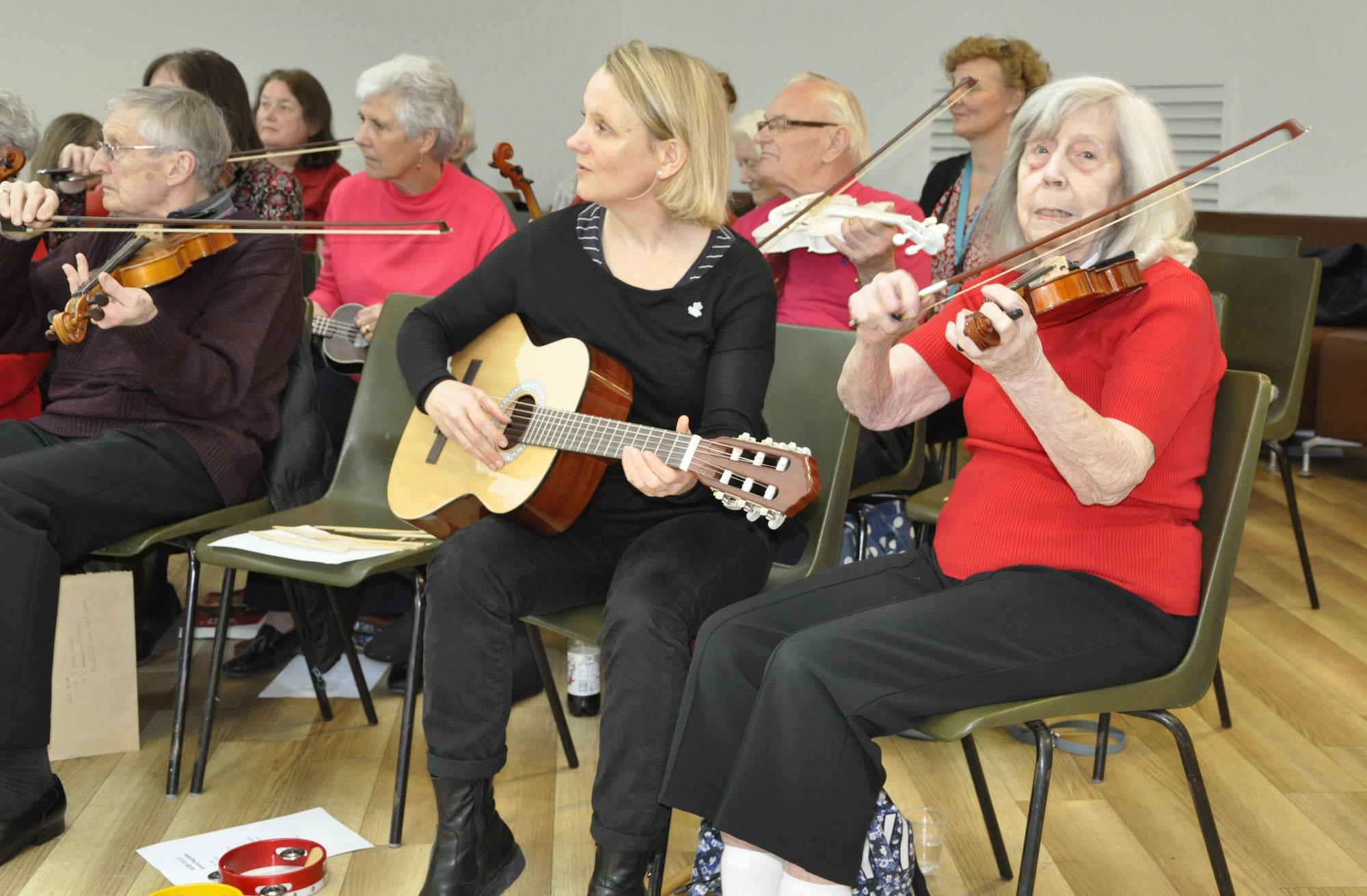 Playing violin in a concert