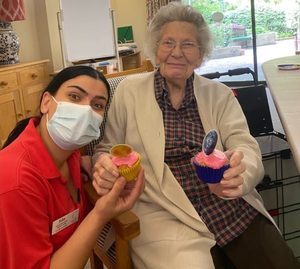 Court Lodge resident Aileen Tullock and Companionship Team Leader Julia Puia, with space cakes