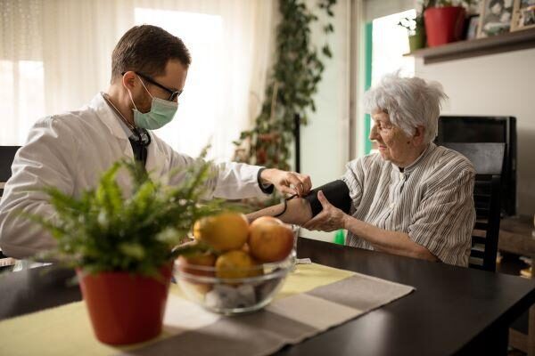 doctor in mask treating patient
